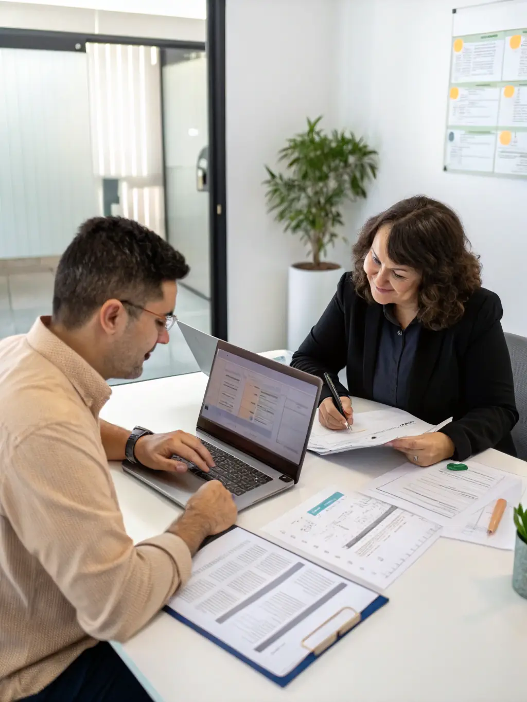 A professional business coach in a modern office setting, reviewing financial reports with a client, both smiling confidently, symbolizing strategic planning and financial success.